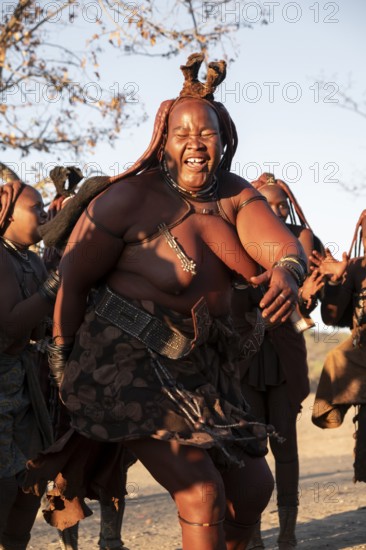Himba woman dancing euphorically, traditional dance, traditional Himba village, Kaokoveld, Kunene,
