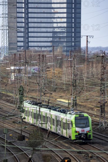 S-Bahn train on the route east, in front of Essen main station, town hall, regional transport North
