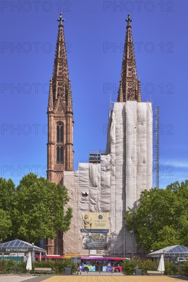 St. Boniface Catholic Church, scaffolding, renovation, trees, blue sky, cirrus clouds, Luisenplatz,