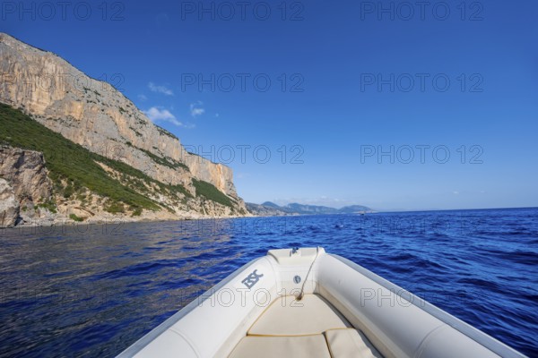 Motorboat trip along the picturesque rocky coast, cliffs and blue sea, Golfo di Orosei, Baunei,
