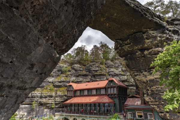 The Prebischtor rock arch and the Hotel Falkennest or Sokolí hnízdo in the Bohemian Switzerland