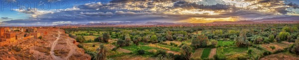Impressive oasis landscape at sunset with a sky full of clouds, Tinghir in Morocco
