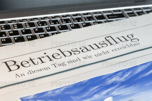 Company outing Symbolic picture: Symbolic newspaper with the headline COMPANY OUTING — WE ARE NOT