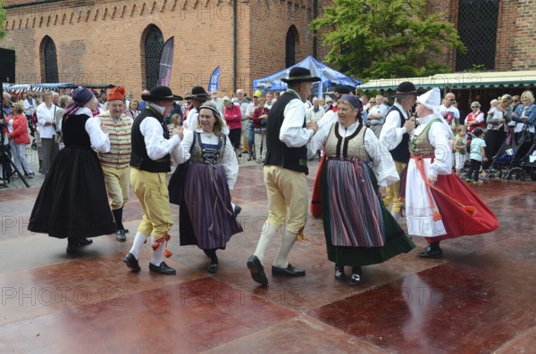 Folk dance performance with dancers in typical costumes from Skåne, in Ystad, Skåne County, Sweden,