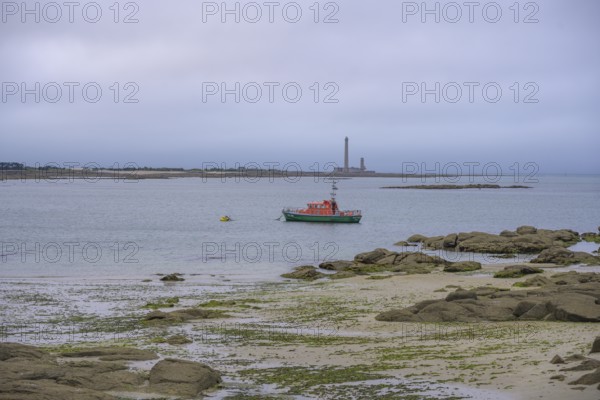 Sea rescue boat behind Phare de Gatteville lighthouse, Barfleur, Manche department, France