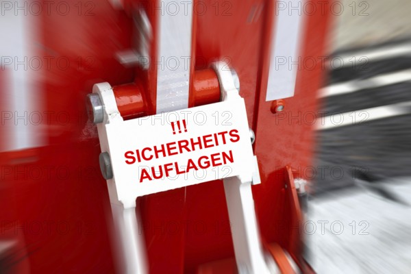 (Photo montage) Close-up of an anti-terrorist lock at a Christmas market with added text SAFETY