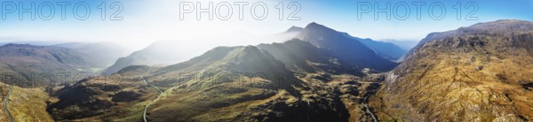 Autumn colours of Pen-y-Pass over Miner's Track, Start Point and road A4086 from a drone,