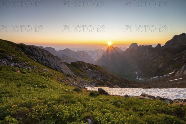 View over Alpstein Mountains into the Meglisalp Valley at sunrise, Rotstein Pass, Säntis,