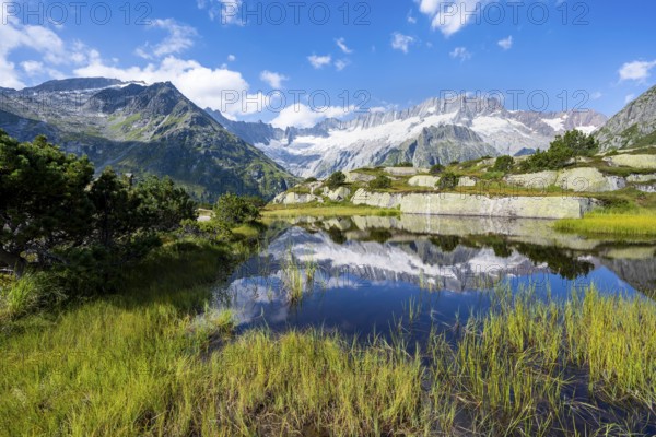 Picturesque mountain landscape, dammastock and damma glaciers reflected in Moorsee, Göscheneralp,