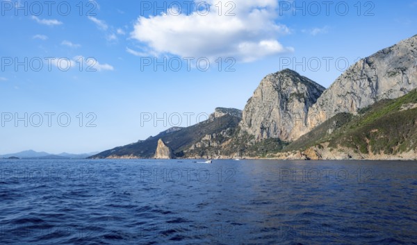 Picturesque rocky coast, cliffs with Pedra Longa pinnacle, blue sea, Golfo di Orosei, Baunei,