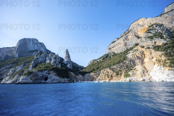 Picturesque rocky coast, cliffs with L'Aguglia pinnacle, blue sea and Cala Goloritzé beach, Golfo