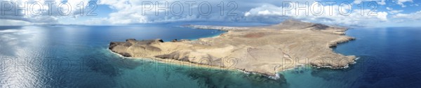 Headland and blue sea, coastal landscape, arid landscape of Los Ajaches Natural Park, aerial view,