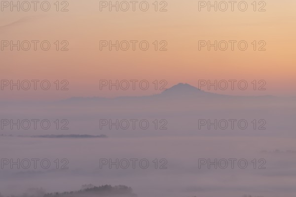 Hohenstaufen in the golden morning light, Aichelberg. Spectacular dawn over the foggy foothills of