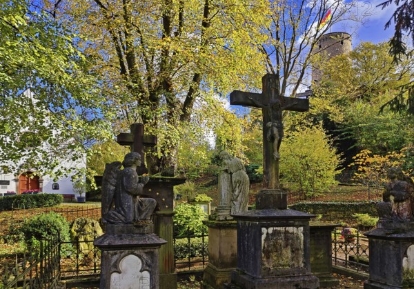 Old tombs at the castle cemetery at St. Michael's Chapel with the Godesburg, Bad Godesberg, Bonn,