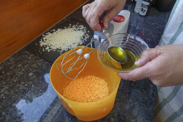 Southern German cuisine, preparing aioli, garlic cream, mayonnaise, oil and minced egg, men's