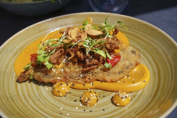 Wiener schnitzel, breaded veal schnitzel, meat dish served on plate, main course, breadcrumbs,