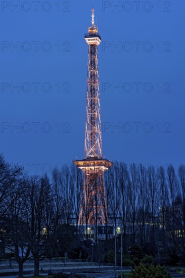 Red illuminated Berlin radio tower, half-timbered steel building by architect Heinrich Straumer,