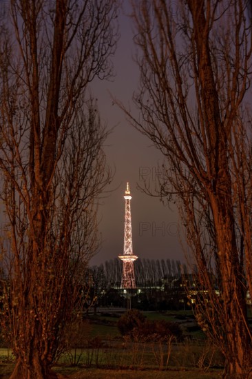 Red illuminated Berlin radio tower, half-timbered steel building by architect Heinrich Straumer,