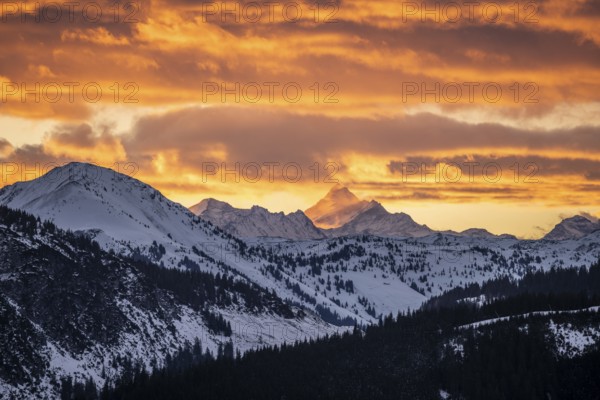 Grossglockner peaks at sunset in winter, spectacular cloudy skies, Hochbrixen, Brixen im Thale,