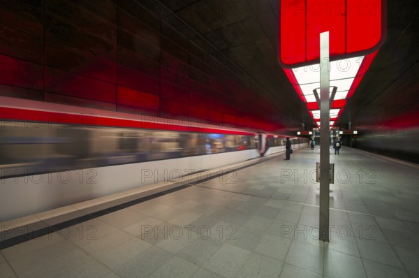 HafenCity University subway station, illuminated in color, red, underground train, movement effect,