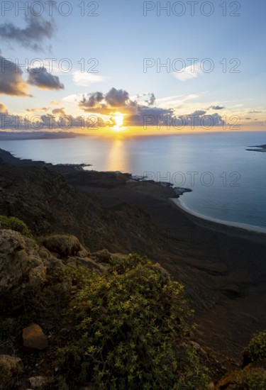 View of steep cliffs on sea and coast, Mirador del Porrito viewpoint at sunset, Lanzarote, Canary