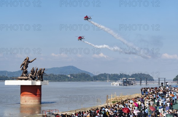 Indian Air Force (IAF) ALH Mk1 Sarang helicopters soar through the sky during an air show as part