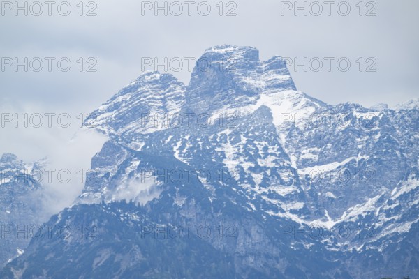 View into the mountains next to Lake Almsee on a rainy day in spring, Traunstein summit,