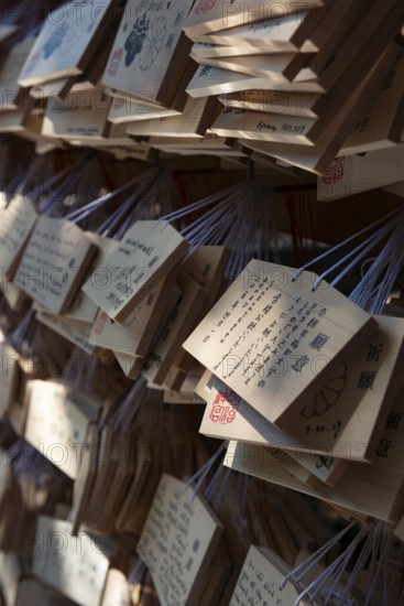 Ema, small wooden tablets with wishes and prayers, hung so that the Kami spirits or gods can