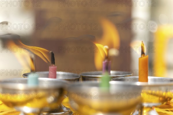 Oil lamps lit by believers as a symbol of the light of wisdom (the light dispels darkness and