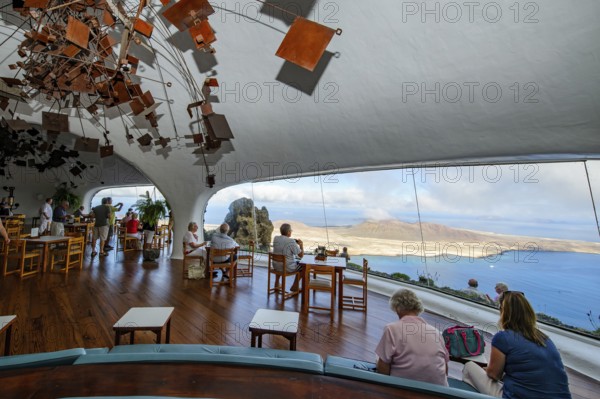 Interior of café with panoramic window in building designed by Cesar Manrique with the
