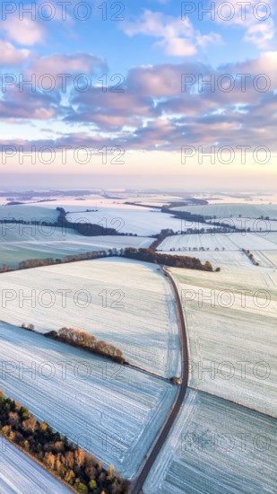 Bird Eye Perspective of Frost Covered Farmland. Seasonal Agricultural Scenery, winter and autumn