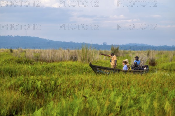 Boat with tourists in Mabamba Swamp, Tourists, Mabamba Swamp, Lake Victoria, Uganda