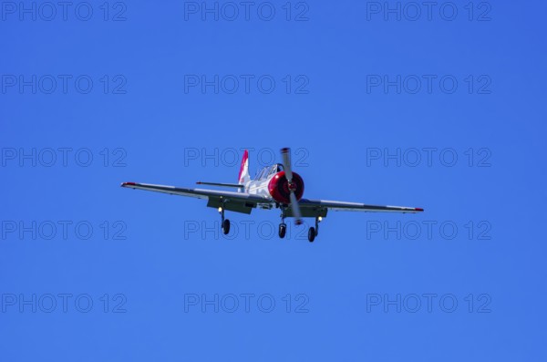 A Jakovlev Jak-52 with registration LY-HLZ during a flight demonstration as part of an air show on