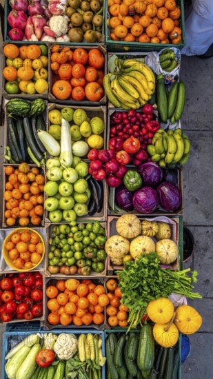 Fresh fruits and vegetables in a market display, aerial view perpendicular top down, healthy eating