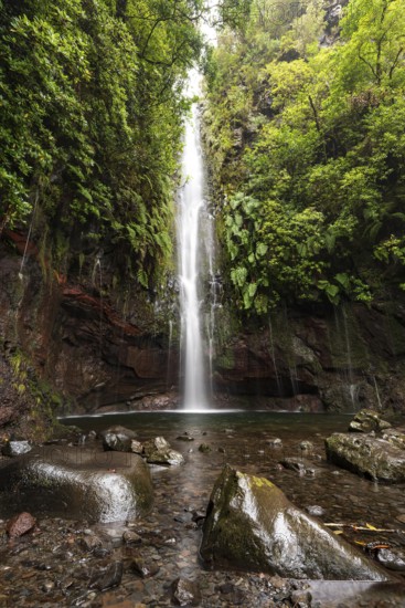A large waterfall and many small watercourses pour down onto the rocks in the mystical 25 Fontes