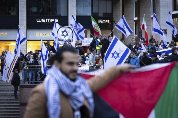 Numerous people gather for a vigil at the Hauptwache in Frankfurt am Main on the second anniversary