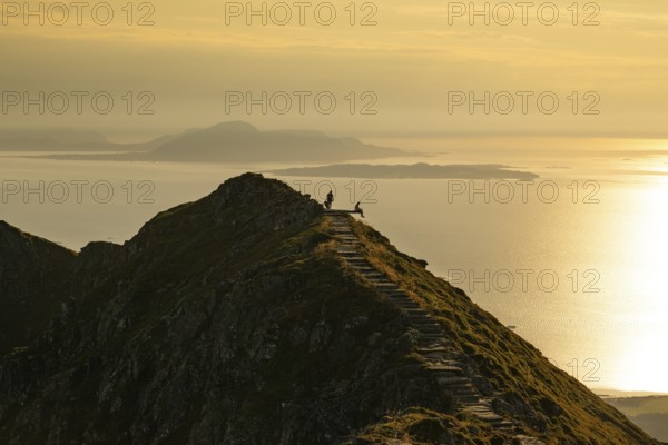 Hikers on the Rørsethornet stone staircase, with 3292 steps one of the longest continuous stone