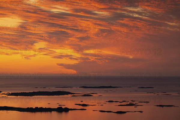 Offshore islands and skerries, sea, dramatically illuminated clouds, sunset, Otroya or Otrøya