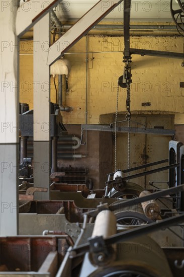 Factory hall with historical machines for the production of cardboard and paper, former paper