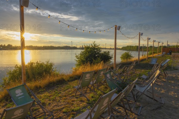 View from the outdoor area of a restaurant at Lankenauer Höft over deckchairs through a string of