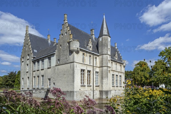 Kasteel Cortewalle, 15th century moated castle in Flemish Renaissance style at Beveren in summer,