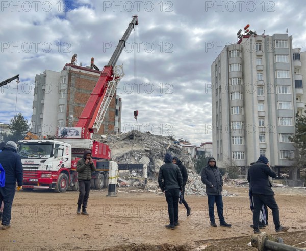 Turkish civil defense teams (AFAD) search for survivors under the rubble after a powerful 7