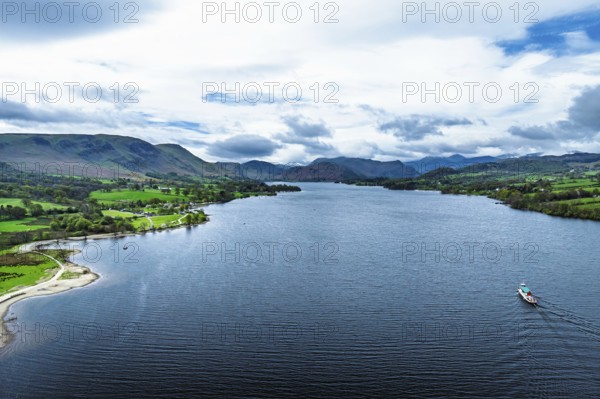 Farms and mountains over Ullswater Lake from drone, Pooley Bridge, Lake District National Park,