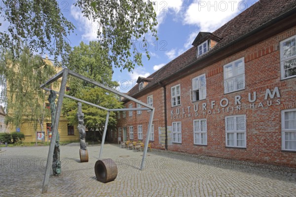 Cultural Forum and Schleswig-Holstein House, brick building, sculpture, inscription, Schelfstadt,