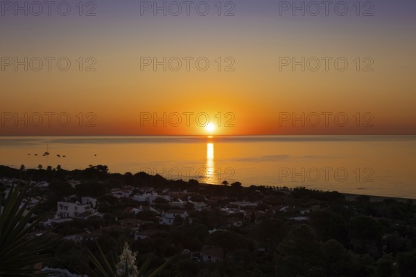 The sun rises on the Costa Rei, a stretch of coastline on the Italian Mediterranean island of