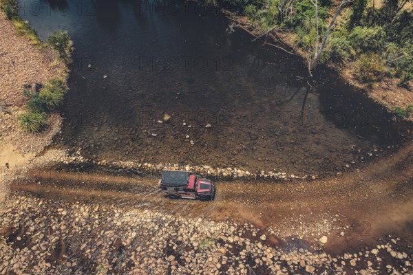 Landrover crosses river in Australian outback in the Kimberley, North West Australia, Australia