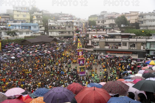 People from the Pnar community march in a circle around a Rot as they celebrate an event organised