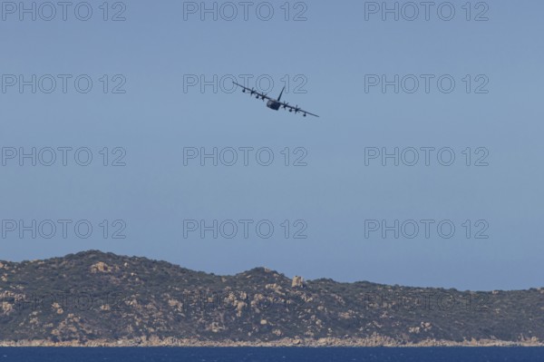A Lockheed Martin MC-130J Commando II, a US Air Force military aircraft, flies low over Costa Rei,