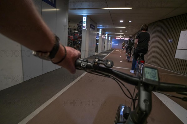Ride your bike into and out of the bicycle car park at Utrecht Centraal station, Stationsplein,