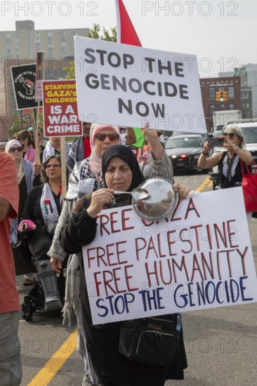 Detroit, Michigan USA - 26 July 2025 - Protesters rally at Eastern Market, banging empty pots to